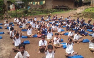 School kids doing yoga. 