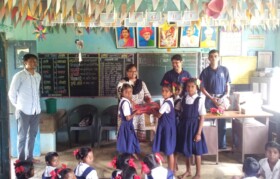 Team Suhrid distributing toys/games to school kids. 