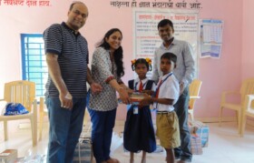 Team Suhrid distributing books to schools