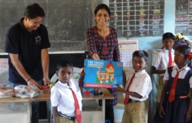 Team Suhrid Foundation handing over games to children. 