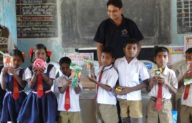Team Suhrid Foundation handing over games to children.