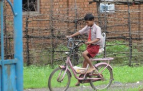 Children playing with bicycle given by Goonj through Suhrid Foundation