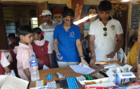 Volunteers distributing medicines