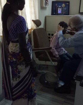 Dr Jobanputra checking a kid from Bahirampada