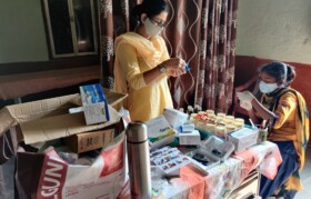 Preparing medicine kit for AGAD health worker
